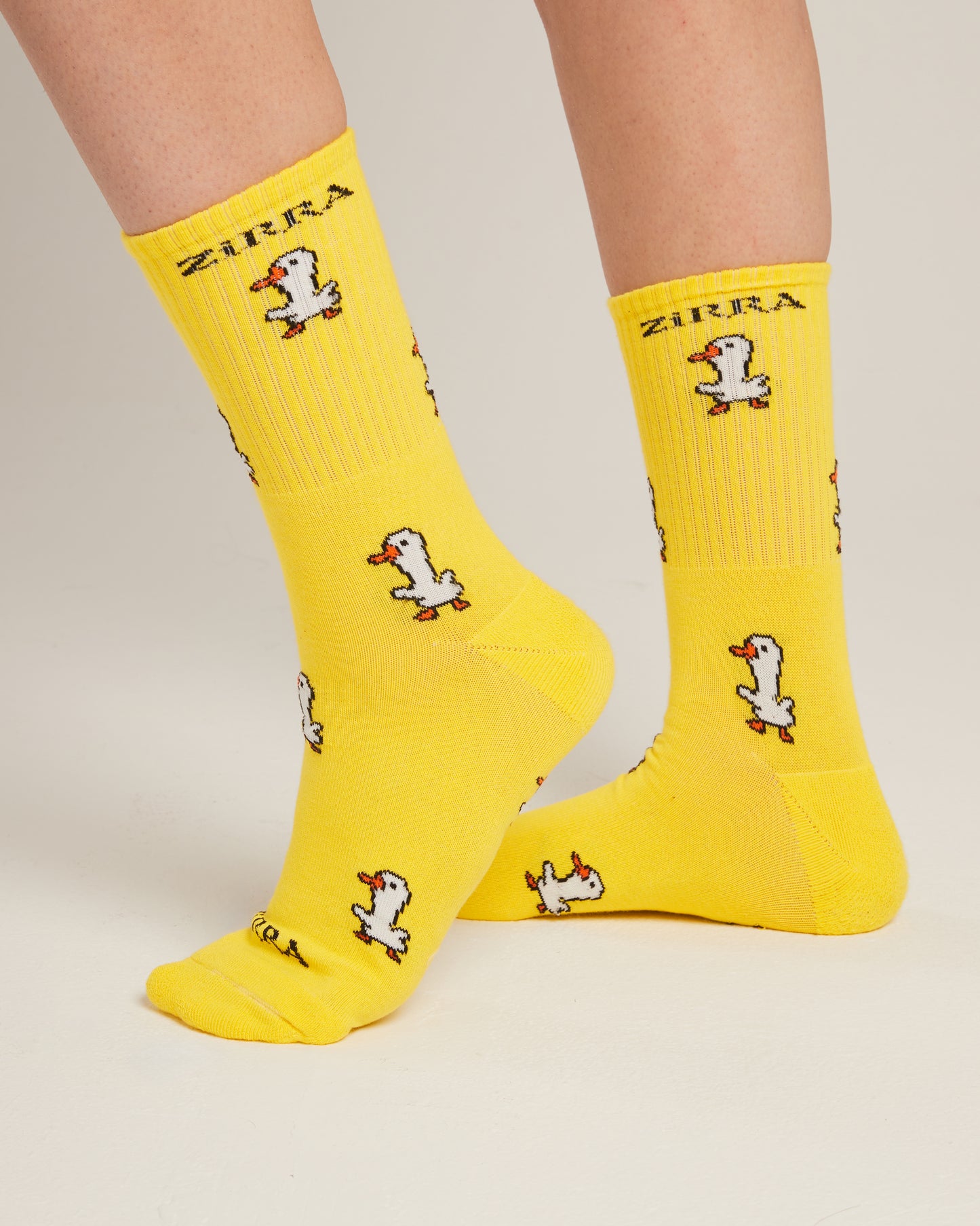 white duck yellow socks