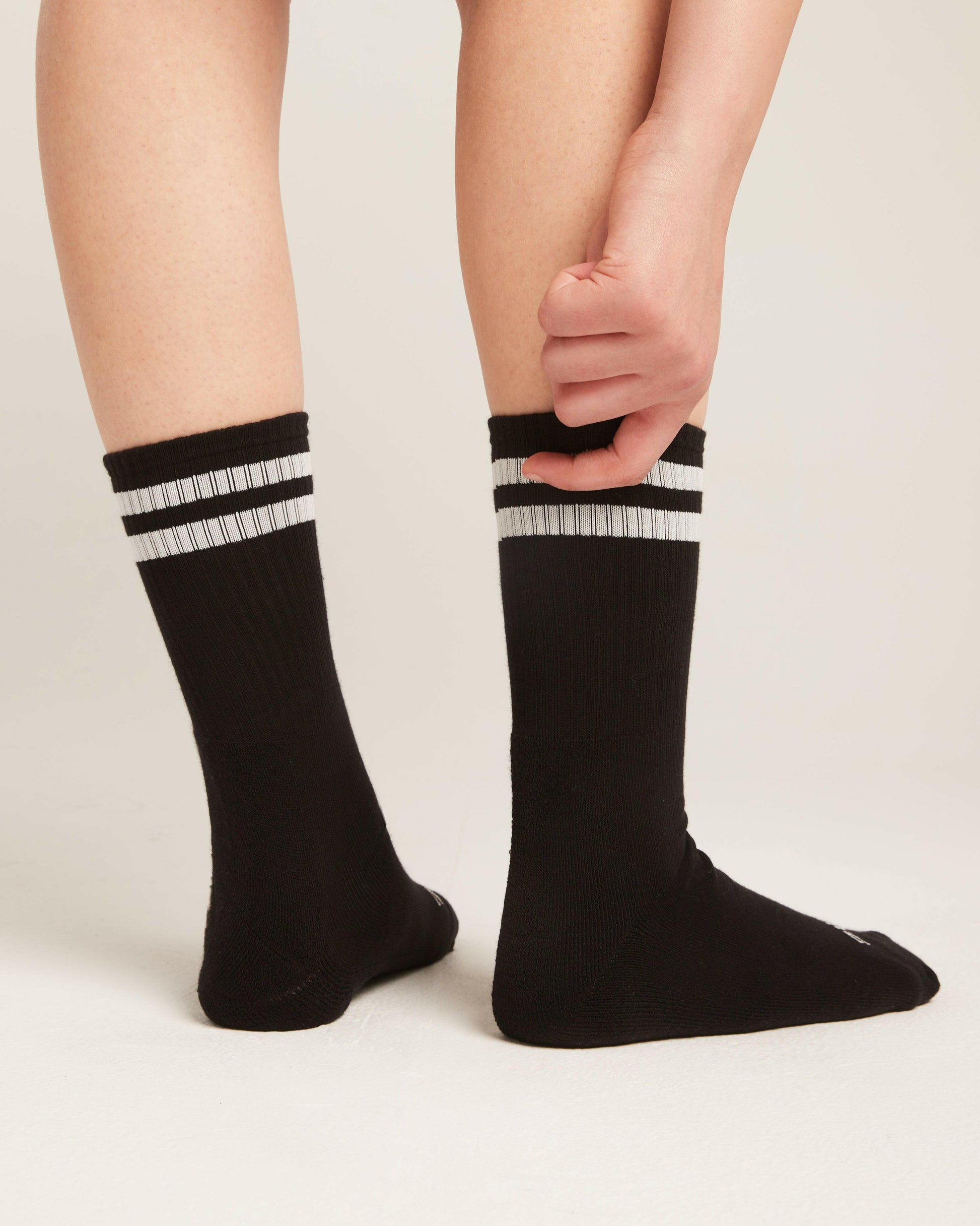 2 strips black socks.